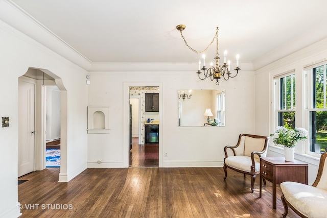 1620 Hyde Park Ave, Waukegan, IL 60085 - sitting room with a chandelier, hardwood / wood-style flooring, arched walkways, and crown molding