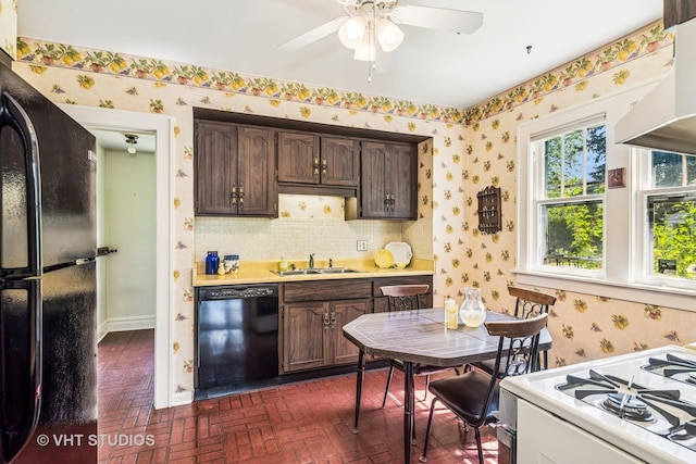 1620 Hyde Park Ave, Waukegan, IL 60085 - kitchen featuring black appliances, brick patterned floors, wallpapered walls, light countertops, and dark brown cabinetry
