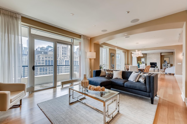 270 E Pearson St Unit 1402, Chicago, IL 60611 - living room with light wood-type flooring, plenty of natural light, and arched walkways