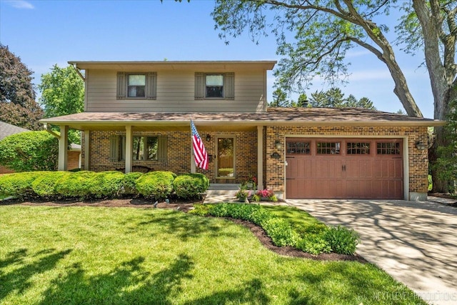 504 Fellows St, Saint Charles, IL 60174 - traditional-style house featuring brick siding, an attached garage, driveway, and a front lawn