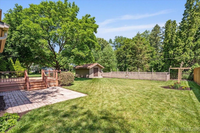 504 Fellows St, Saint Charles, IL 60174 - view of yard featuring a patio, an outbuilding, and a wooden deck