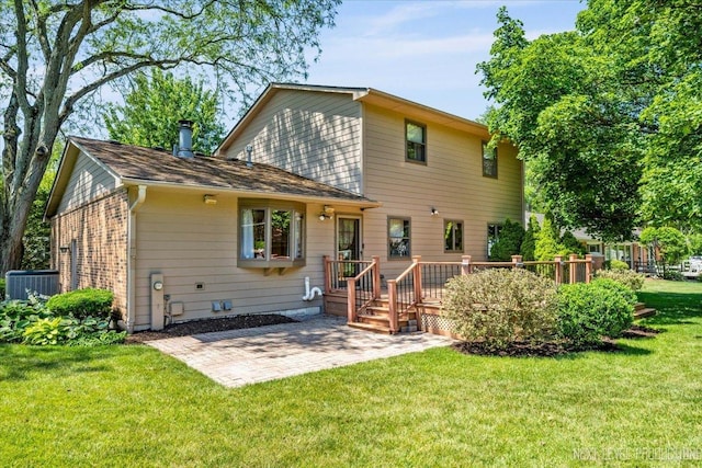 504 Fellows St, Saint Charles, IL 60174 - back of property with a patio area, a wooden deck, and a lawn