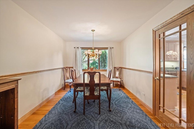 504 Fellows St, Saint Charles, IL 60174 - dining room featuring a chandelier and light wood-type flooring