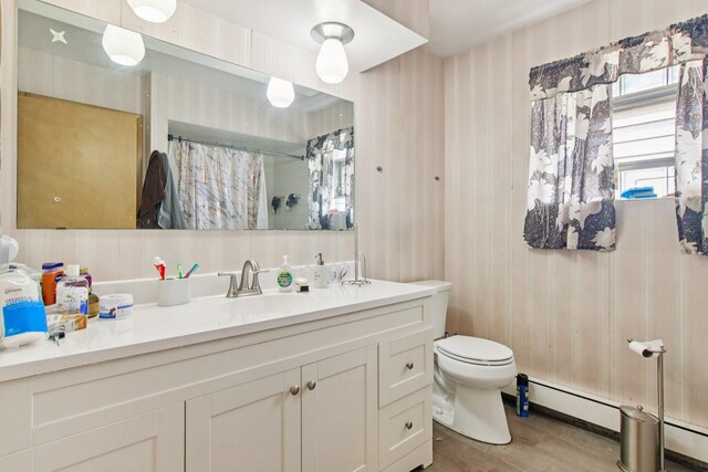 949 E 170th St, South Holland, IL 60473 - full bath with vanity, wood finished floors, curtained shower, and a baseboard heating unit