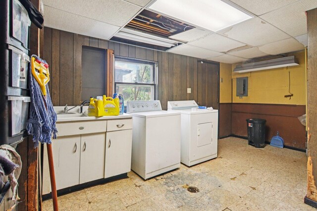 949 E 170th St, South Holland, IL 60473 - laundry room featuring washer and clothes dryer, wood walls, light flooring, cabinet space, and electric panel