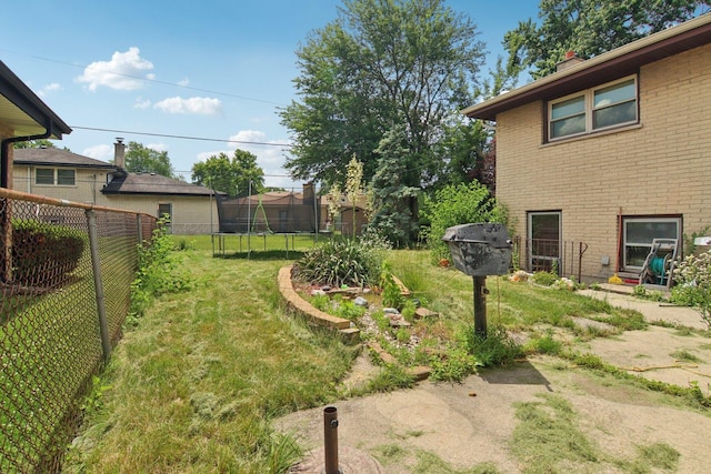 949 E 170th St, South Holland, IL 60473 - fenced backyard with a trampoline