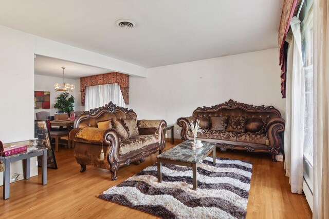 949 E 170th St, South Holland, IL 60473 - living area with a chandelier and wood finished floors