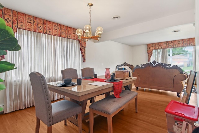 949 E 170th St, South Holland, IL 60473 - dining area with a chandelier and light wood-style floors