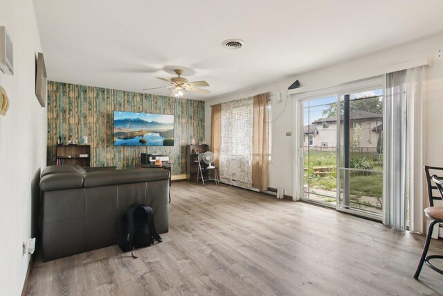 949 E 170th St, South Holland, IL 60473 - living room with an accent wall, ceiling fan, wallpapered walls, and wood finished floors
