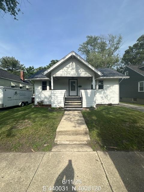 14837 Karlov Ave, Midlothian, IL 60445 - bungalow featuring a front lawn and a porch