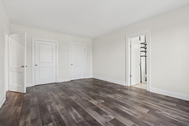 1755 E 55th St Unit 503, Chicago, IL 60615 - unfurnished bedroom with dark wood-style floors