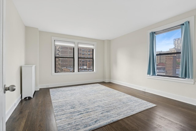 1755 E 55th St Unit 503, Chicago, IL 60615 - unfurnished room featuring dark wood finished floors and baseboards