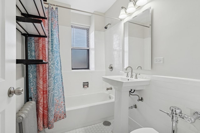 1755 E 55th St Unit 503, Chicago, IL 60615 - full bath featuring radiator, shower / bath combo, a wainscoted wall, and tile patterned floors