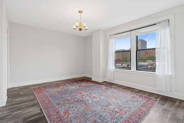 1755 E 55th St Unit 503, Chicago, IL 60615 - empty room with a chandelier and wood finished floors