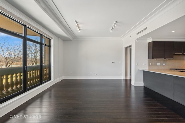 2550 N Lakeview Ave Unit N204, Chicago, IL 60614 - unfurnished living room with rail lighting, dark wood-style floors, and crown molding