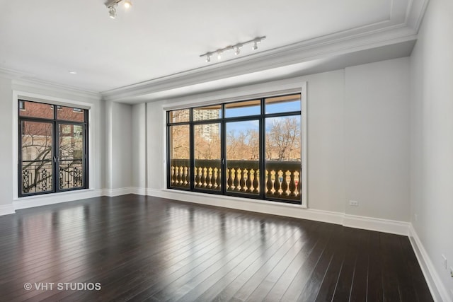 2550 N Lakeview Ave Unit N204, Chicago, IL 60614 - unfurnished room featuring rail lighting, ornamental molding, and hardwood / wood-style floors