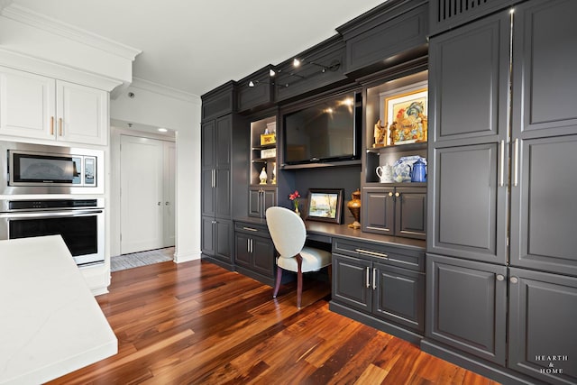 77 S Evergreen Ave Unit 1103, Arlington Heights, IL 60005 - home office with built in desk, ornamental molding, and dark wood finished floors