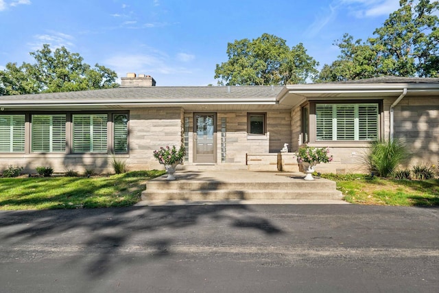 200 N Forest Ct, Addison, IL 60101 - view of front of home featuring stone siding and a chimney