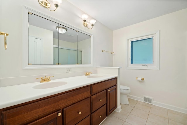 200 N Forest Ct, Addison, IL 60101 - bathroom featuring double vanity, tile patterned floors, and a shower with shower door