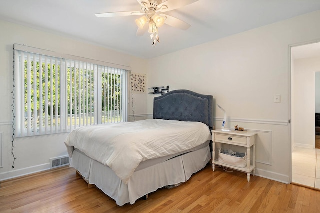 200 N Forest Ct, Addison, IL 60101 - bedroom with light wood finished floors and ceiling fan