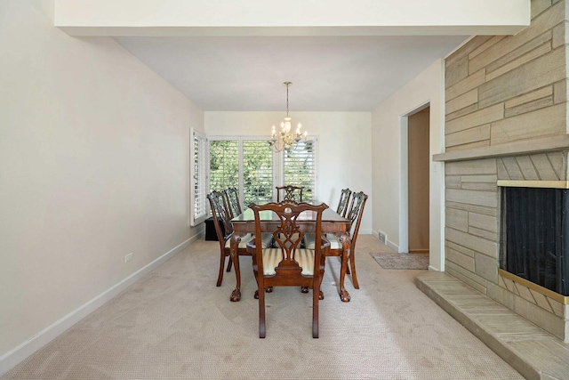 200 N Forest Ct, Addison, IL 60101 - dining room featuring a chandelier, a fireplace, and light colored carpet