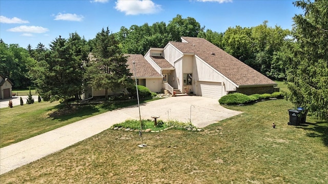 3125 Chellington Dr, Johnsburg, IL 60051 - view of front facade with driveway, a garage, and a front lawn