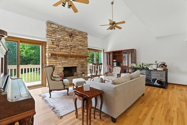3125 Chellington Dr, Johnsburg, IL 60051 - living room featuring a fireplace, a ceiling fan, high vaulted ceiling, and healthy amount of natural light