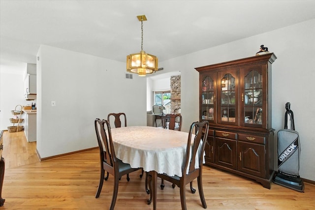 3125 Chellington Dr, Johnsburg, IL 60051 - dining area with a chandelier and light wood finished floors