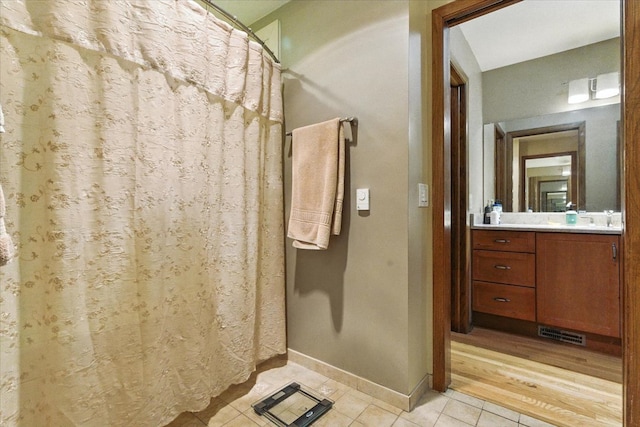 3125 Chellington Dr, Johnsburg, IL 60051 - bathroom featuring tile patterned floors, vanity, and curtained shower