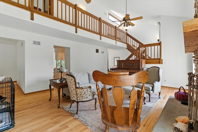 3125 Chellington Dr, Johnsburg, IL 60051 - dining space featuring ceiling fan, a high ceiling, light wood finished floors, and stairway