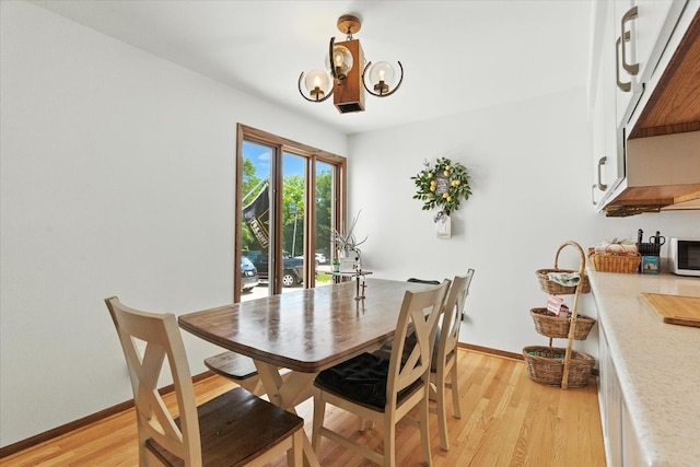 3125 Chellington Dr, Johnsburg, IL 60051 - dining space featuring a chandelier and light wood-type flooring