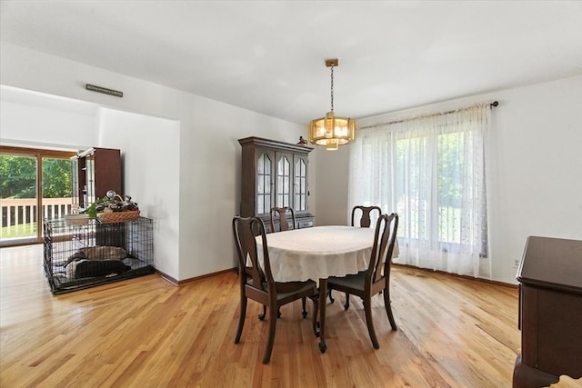 3125 Chellington Dr, Johnsburg, IL 60051 - dining space featuring plenty of natural light, a chandelier, and light wood-style flooring