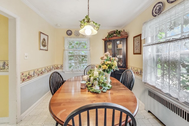 218 N Merrill St, Park Ridge, IL 60068 - dining space with radiator, plenty of natural light, light floors, and ornamental molding