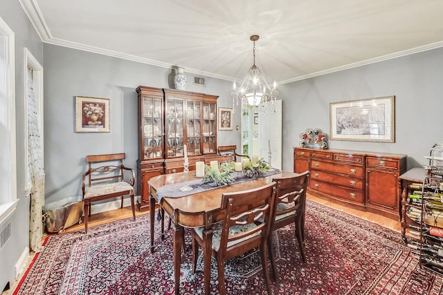 218 N Merrill St, Park Ridge, IL 60068 - dining room with a chandelier, wood finished floors, and ornamental molding