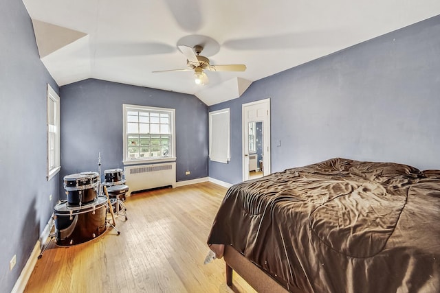 218 N Merrill St, Park Ridge, IL 60068 - bedroom featuring radiator heating unit, light wood-type flooring, vaulted ceiling, and ceiling fan