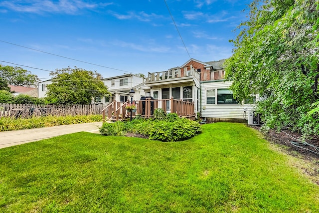 218 N Merrill St, Park Ridge, IL 60068 - back of property featuring a balcony and a wooden deck