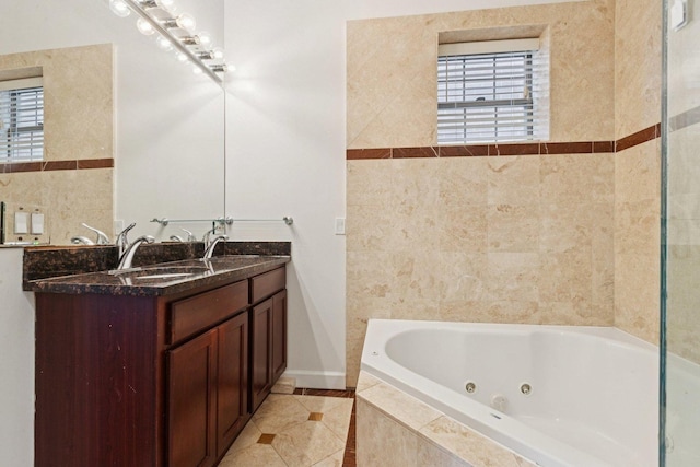 4243 N Keystone Ave Unit 2S, Chicago, IL 60641 - full bath with a jetted tub, healthy amount of natural light, double vanity, and tile patterned floors