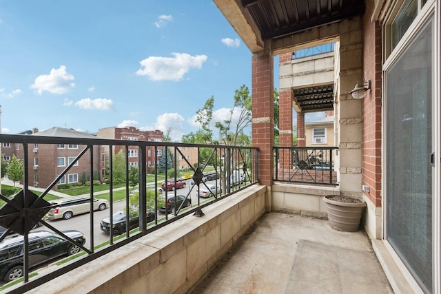 4243 N Keystone Ave Unit 2S, Chicago, IL 60641 - unfurnished living room with wood finished floors, a tile fireplace, crown molding, and recessed lighting