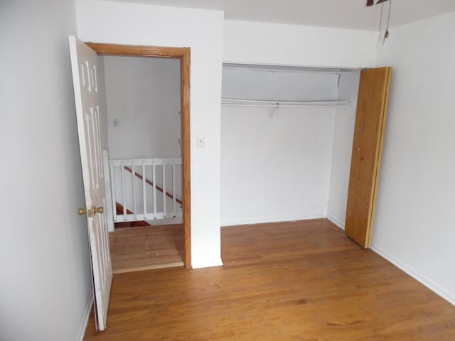 8001 S Essex Ave, Chicago, IL 60617 - unfurnished bedroom featuring wood finished floors and a closet