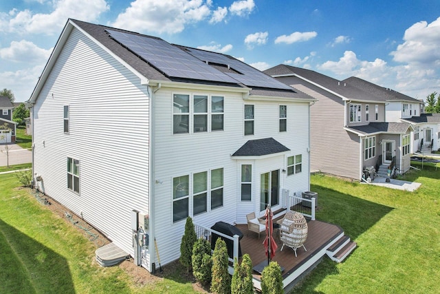 3620 Ambrosia Dr, Naperville, IL 60564 - rear view of property featuring solar panels, a yard, a deck, entry steps, and a shingled roof