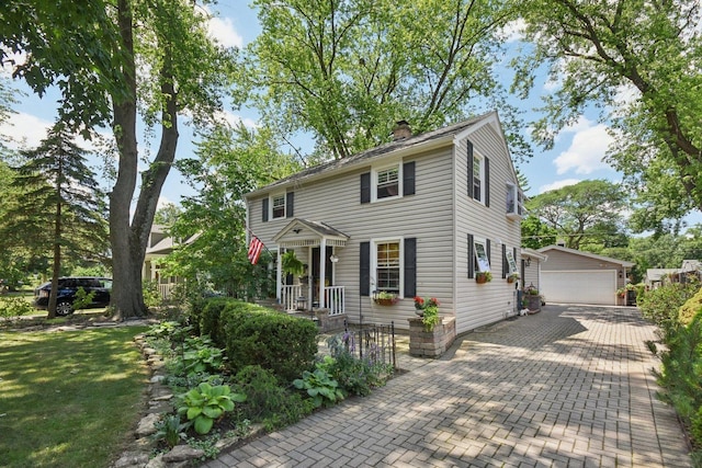 1427 S 5th St, Saint Charles, IL 60174 - colonial home featuring a detached garage, an outdoor structure, and a chimney