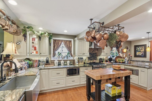 1427 S 5th St, Saint Charles, IL 60174 - kitchen with stainless steel appliances, a warming drawer, tasteful backsplash, light stone countertops, and recessed lighting