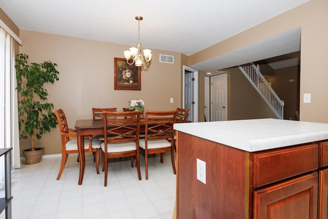 7 Crystal Ct, Bloomington, IL 61704 - dining space with a chandelier, stairway, and light flooring