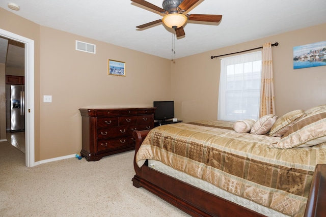 7 Crystal Ct, Bloomington, IL 61704 - bedroom with stainless steel fridge, light carpet, and ceiling fan