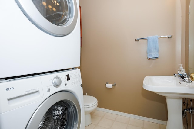7 Crystal Ct, Bloomington, IL 61704 - bathroom with stacked washer and clothes dryer and baseboards