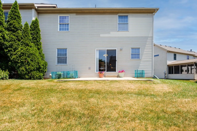 7 Crystal Ct, Bloomington, IL 61704 - back of property with a sunroom, a lawn, and a patio area