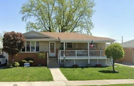 7707 S Oketo Ave, Bridgeview, IL 60455 - view of front facade featuring covered porch and a front yard