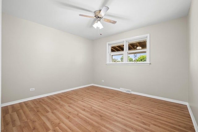 7707 S Oketo Ave, Bridgeview, IL 60455 - unfurnished room featuring light wood-type flooring and a ceiling fan