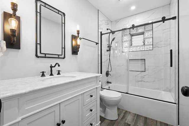 7707 S Oketo Ave, Bridgeview, IL 60455 - bathroom with vanity, bath / shower combo with glass door, and wood finished floors