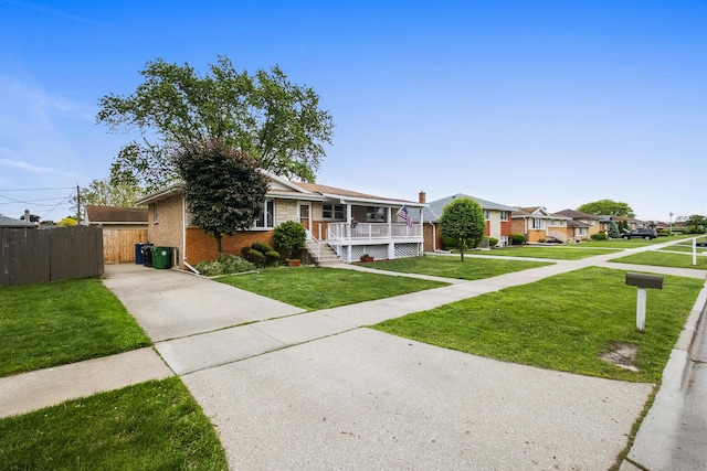 7707 S Oketo Ave, Bridgeview, IL 60455 - view of front of property with a porch, brick siding, concrete driveway, and a residential view